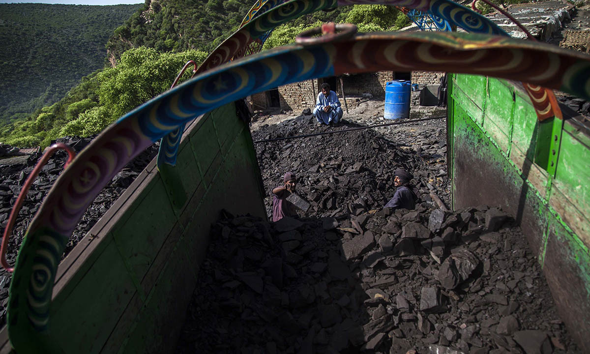 A miner loads coal onto a truck outside a mine in Choa Saidan Shah, Punjab province, April 29, 2014.  — Photo by Reuters