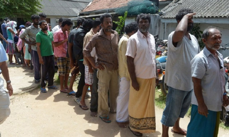 Asylum-seekers held on an Australian customs vessel being transported to India. &mdash; Photo by AFP