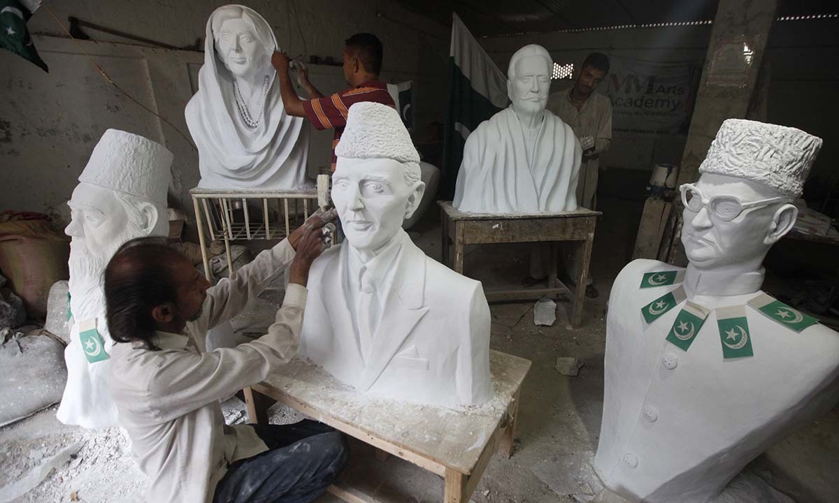 Pakistani artist Mubarak Hussain puts the final touches on a statue of Muhammad Ali Jinnah, founder of Pakistan ahead of  Pakistan's Independence Day. — Photo by Reuters