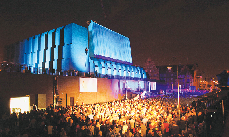 Guests intermingle at the opening night of the Gdansk Shakespeare Theatre building on Friday.—AFP