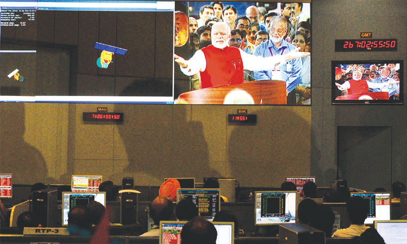 BANGALORE: Scientists and engineers of the Indian Space Research Organisation watch Prime Minister Narendra Modi on the screen after their spacecraft entered the orbit of Mars on Wednesday.—Reuters