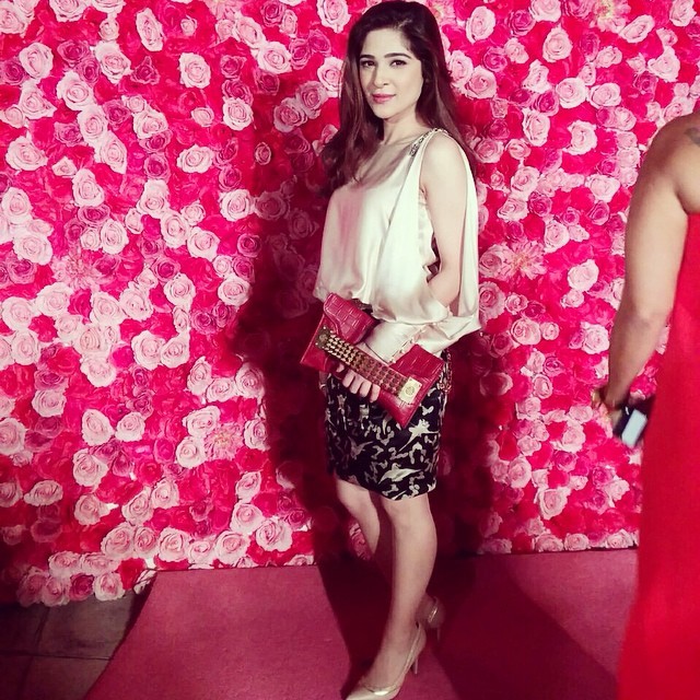  Ayesha Omar wears her monochrome Shehla Chatoor ensemble with a red studded clutch for a pop of colour. Photo courtesy - Styleonpaper Instagram 