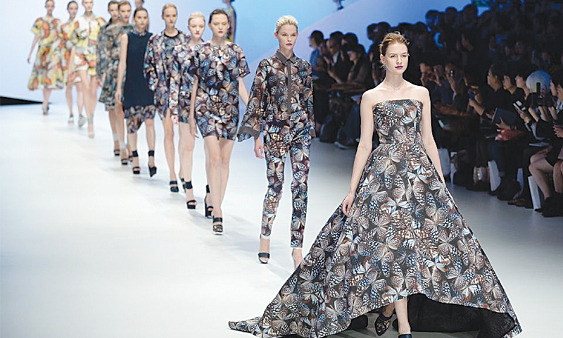 MODELS display creations during the spring/summer 2015 collection designed by Yu Amatsu at Tokyo Fashion Week.—AFP