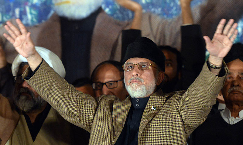 Tahir ul Qadri waves to supporters. – AFP Photo