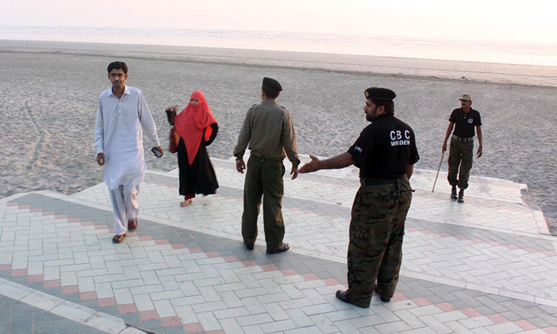 Policemen asking people to leave Sea View Beach in anciticpation of tropical cycle Nilofar. –INP Photo