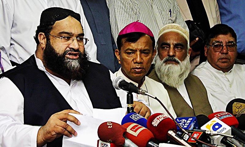 Pakistan Ulema Council chairman Hafiz Tahir Mahmood Ashrafi addressing a press conference regarding Kot Radha Kishan incident at Lahore Press Club.- Online