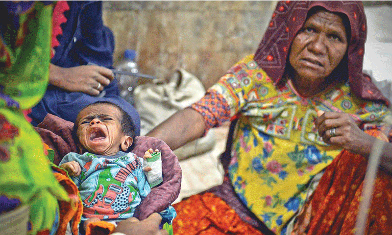 A woman comforting her child, who was born prematurely and received little post-natal care at the Civil Hospital, Mithi. — Fahim Siddiqi/White Star