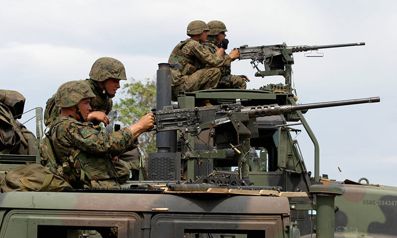 US Marines man pintle-mounted M2HB machine guns. – Wikimedia commons