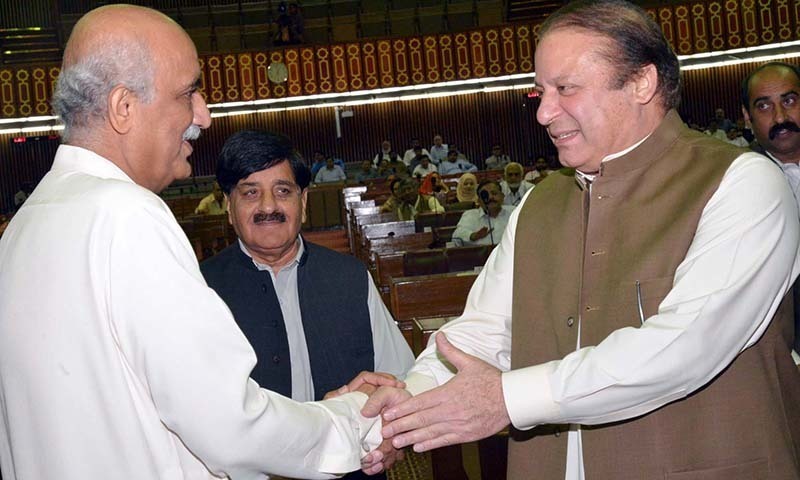 This picture shows Prime Minister Nawaz Sharif shaking hands with opposition leader Syed Khursheed Shah during a National Assembly session. — PPI/File