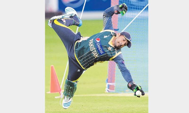 DUBAI: Pakistan wicket-keeper Sarfraz Ahmed takes a catch during a nets session at the Dubai International Stadium on Wednesday.&mdash;AFP
