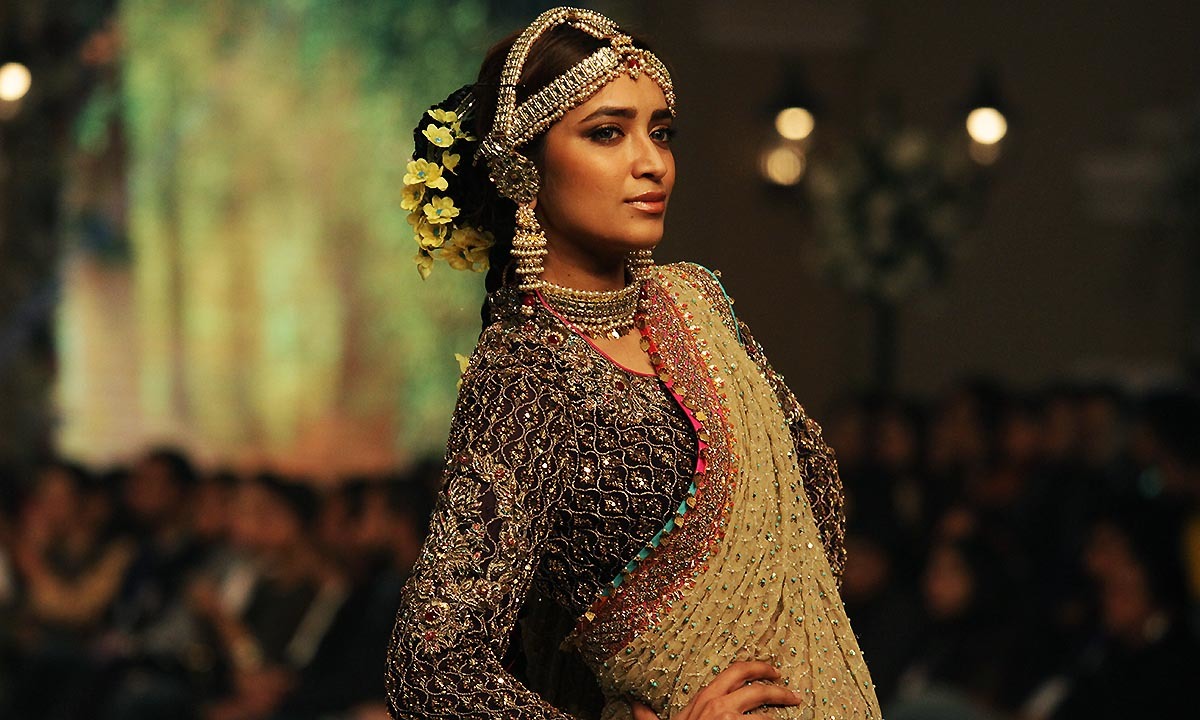 A presents a creation by designer Fahad Hussayn during the Telenor Bridal Couture Week 2014, in Lahore, Pakistan, Friday, Dec. 12, 2014.—AP