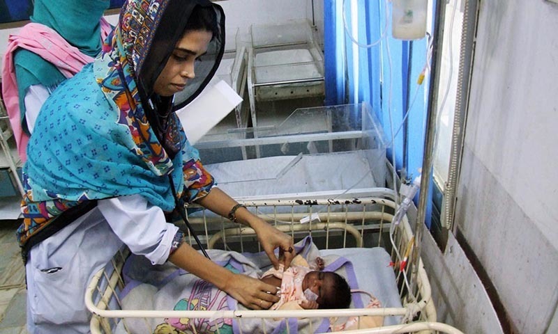 A doctor attending to a child from Tharparkar at Civil Hospital Hyderabad.- Online