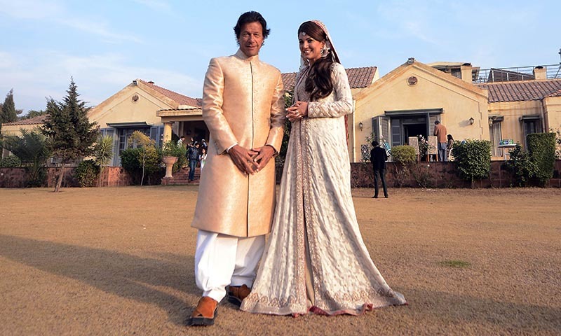 In this handout photograph released by the Pakistan Tehreek-i-Insaf (PTI)  on January 8, 2015, Imran Khan (L) and new wife Reham Khan pose for a photograph during their wedding ceremony at his house in Islamabad. — AFP