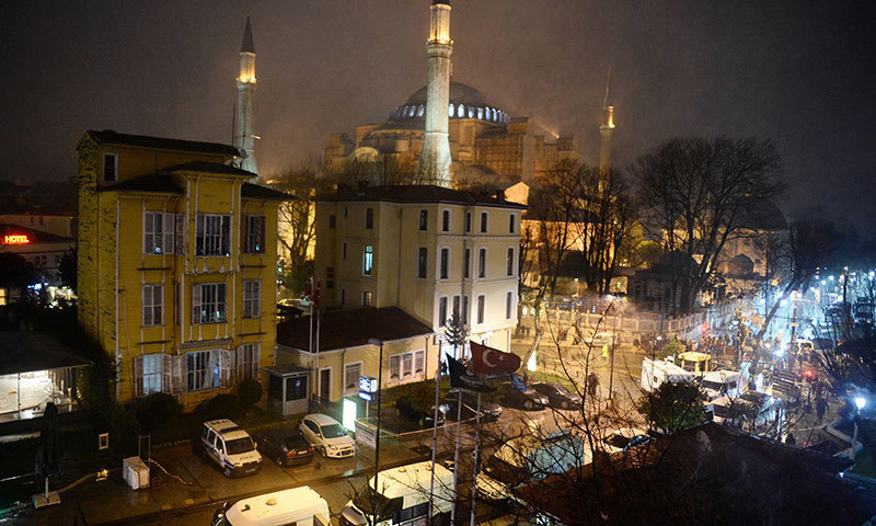 A general view of a police station, at left, where a Turkish police officer was killed and another injured following a suicide attack in Istanbul, Turkey, Tuesday, Jan. 6, 2015. — AP