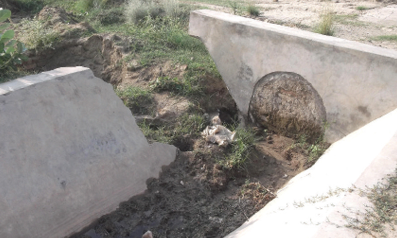 Broken canal of Dharabi Dam near Bikhari Kalan village. &mdash; Dawn