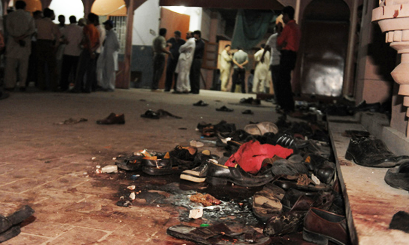 The photo shows Ahmadi community members gathering at their worship place after a suicide attack in Lahore on May 28, 2010. — AFP/File photo