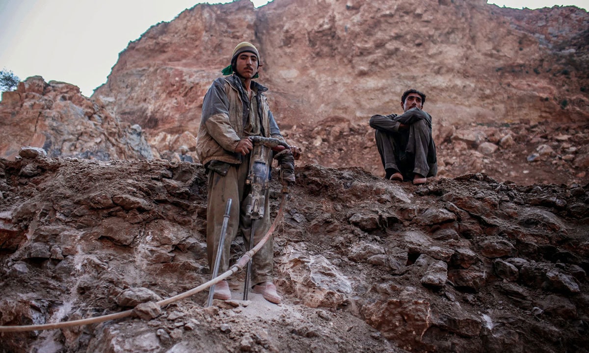 Mohammad Ali is 15 and belongs to a village in Swabi. His friends call him the drill man. A drilled hole is filled with explosives for blasting which helps to break off large chunks of rock from the mountain. - Photo by writer