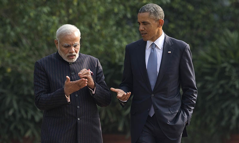 President Barack Obama talks with Indian Prime Minister Narendra Modi, left, in the gardens of the Hyderabad House in, New Delhi, India, Sunday, Jan. 25, 2015. — AP