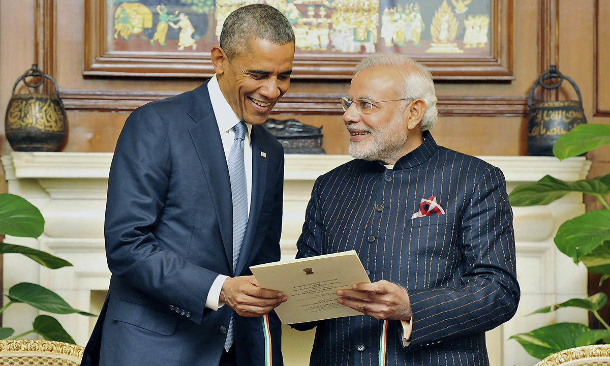 India's Prime Minister Narendra Modi (R) presents a reproduction of telegram sent by US to the Indian Constituent Assembly in 1946, to US President Barack Obama during their meeting in New Delhi January 25, 2015. — Reuters