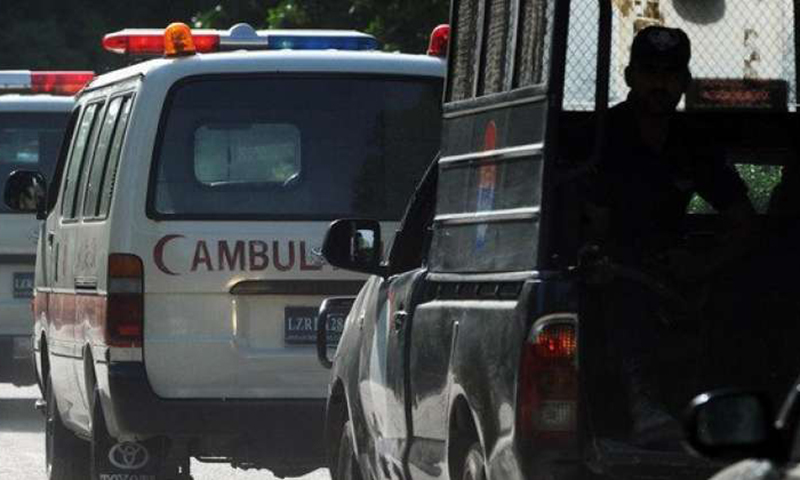 In this photo, an ambulance is being followed by a police van. &mdash; AFP/File