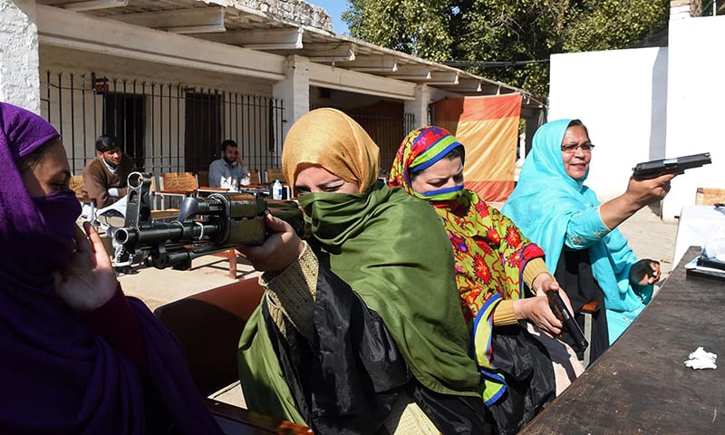 Pakistani teachers handle various firearms during a weapons training session for school, college and university teachers at a police training centre in Peshawar. —AFP/File