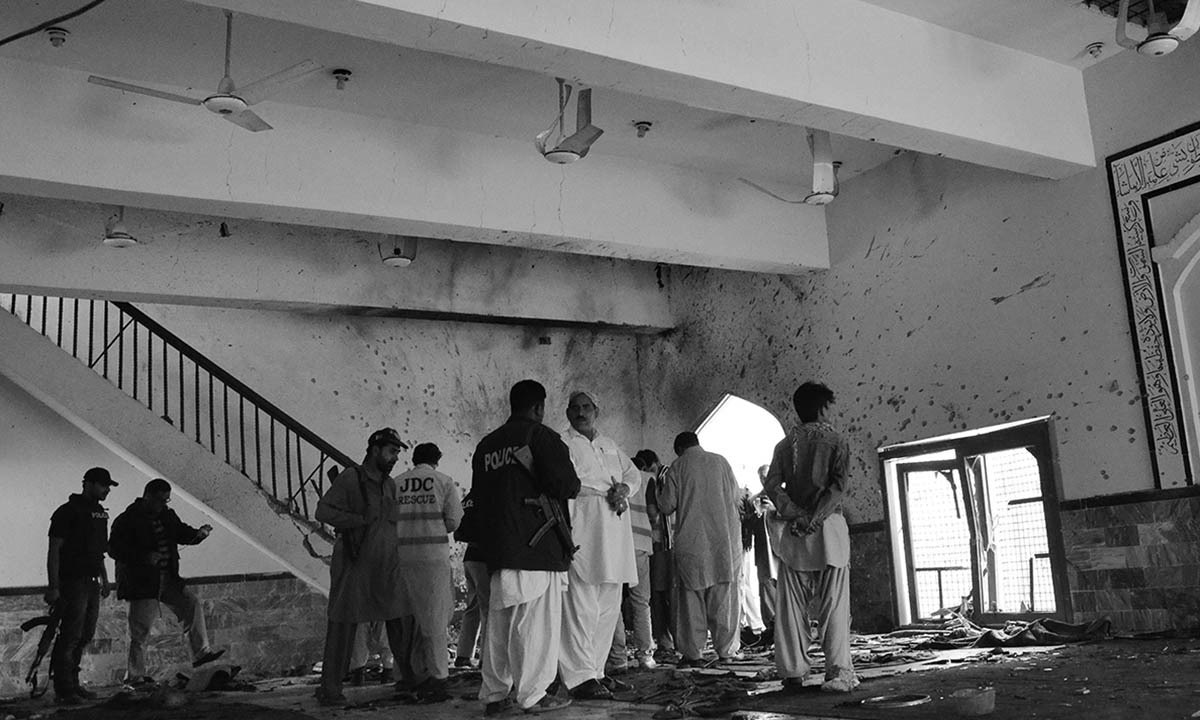 Pakistani security officials and police examine the scene following a bomb attack at a Shiite Muslim mosque in Shikarpur in Sindh province.—AFP/File