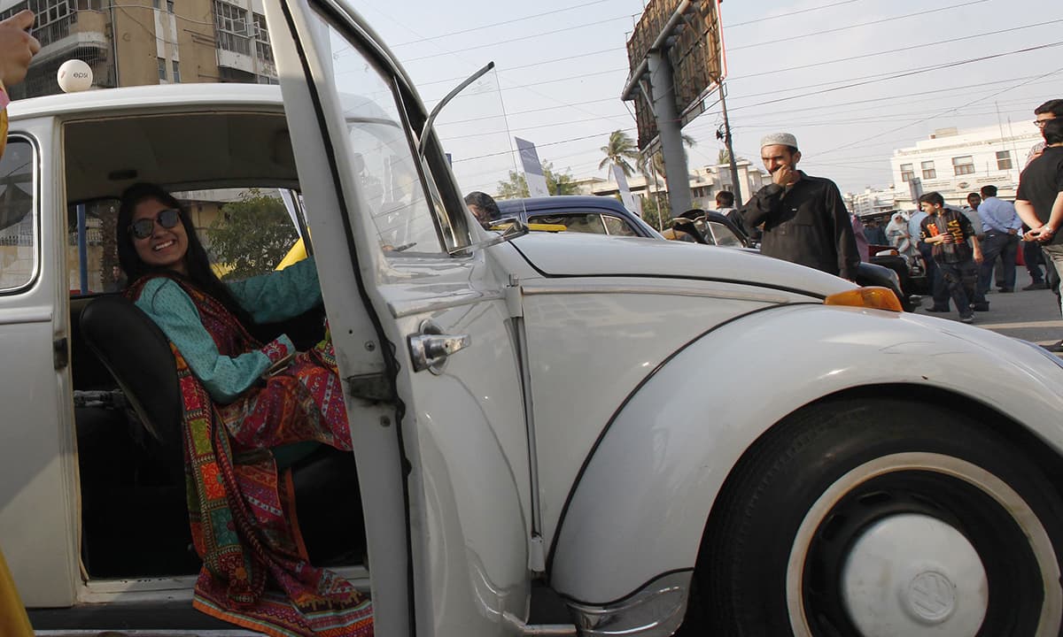 A visitor sits in a Volkswagen Beetle car. &mdash; Reuters