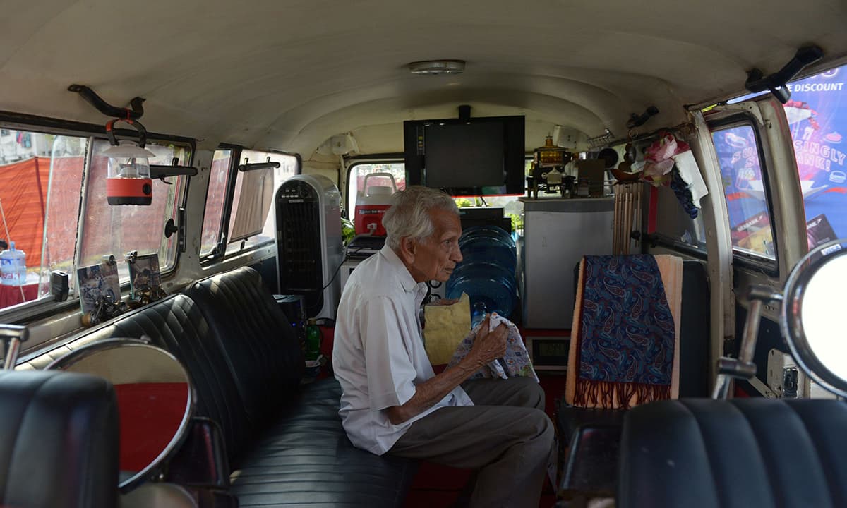 A man is pictured inside a Volkswagen Microbus. &mdash; AFP