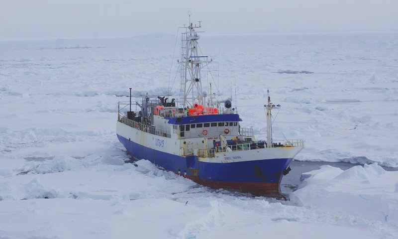 In this image provided by the US Coast Guard, an Australian fishing vessel is seen from a cutter employed to break up the ice around the vessel. Rescuers reached the fishing boat with 26 people aboard trapped in ice near Antarctica and plan to use an unmanned underwater vehicle to assess the damage to it.—AP