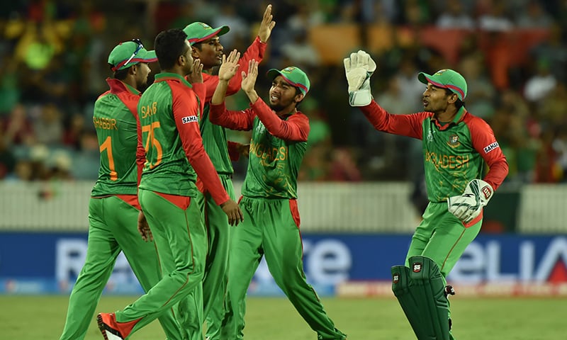 Bangladesh players celebrate after taking out Nawroz Mangal of Afghanistan during the pool A World Cup match between Afghanistan and Bangladesh in Canberra. &mdash; AFP