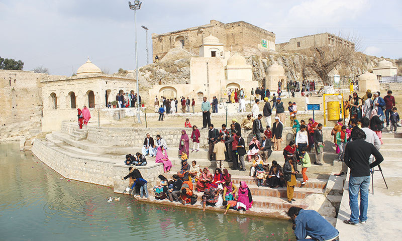 Pilgrims at a pond at Katas Raj.— Nabeel Anwar Dhakku/file