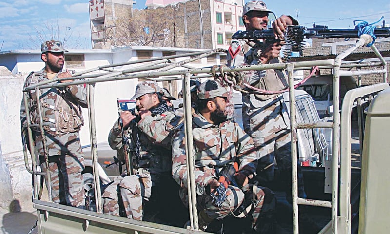 CHAMAN: FC personnel patrol an area to protect health workers during a three-day polio vaccination campaign on Monday. The campaign was put off in Quetta, Zhob and Sherani districts because of security concerns.—APP           Related report on Page 5