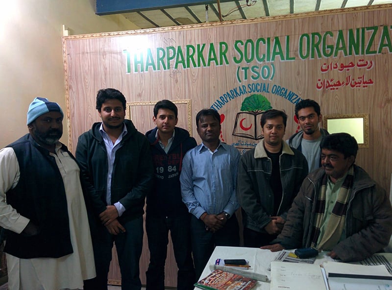 The author, with his team from 'Humans of Pakistan' seen with Mr Nizam (extreme left), a Muslim, and Mama Vishan (extreme right), a Hindu, who are running a welfare organisation which provides blood donations and ambulance services to the people of Mithi. The friendship between Nizam and Vishan goes back 25 years.