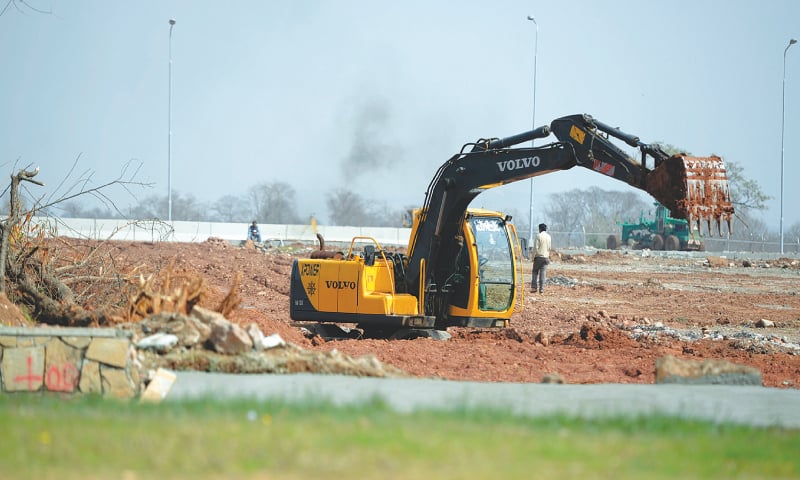 CONSTRUCTION work under way on Monday at the venue near Shakarparian where Pakistan Day Parade will be held after seven years on March 23.&mdash;Tanveer Shahzad / White Star