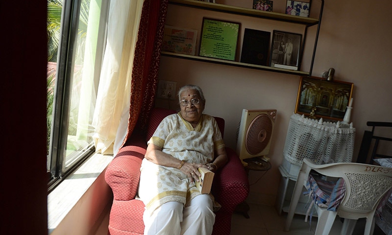 In this photograph taken on March 10, 2015, elderly Indian citizen Hemlata Parikh poses in her home during an interview with AFP at The Dignity Foundation Township in Neral some 50kms east of Mumbai in the western Indian state of Maharashtra.— AFP