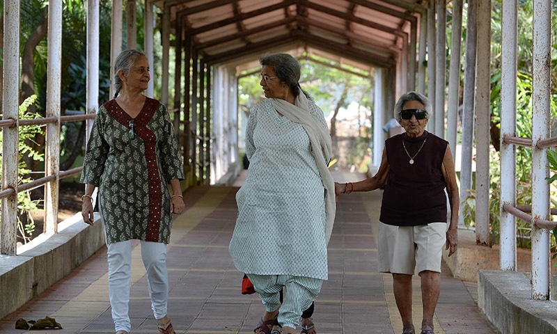 In this photograph taken on March 10, 2015, elderly Indian citizens arrive at the dining hall at The Dignity Foundation Township in Neral some 50kms east of Mumbai in the western Indian state of Maharashtra. — AFP