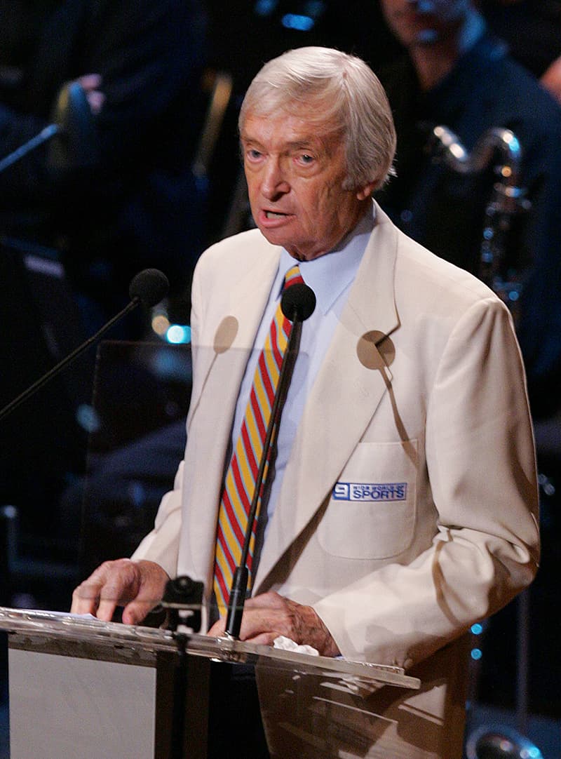 In this February 17, 2006 photo, Richie Benaud speaks at a state memorial service for Kerry Packer at Sydney Opera House. &mdash; AP/File