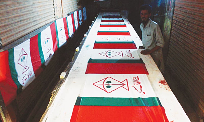 Gainful employment: A printer in Azam Square makes decent money preparing flags for various parties