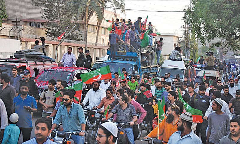 A PTI rally passes through Tahirwala Road