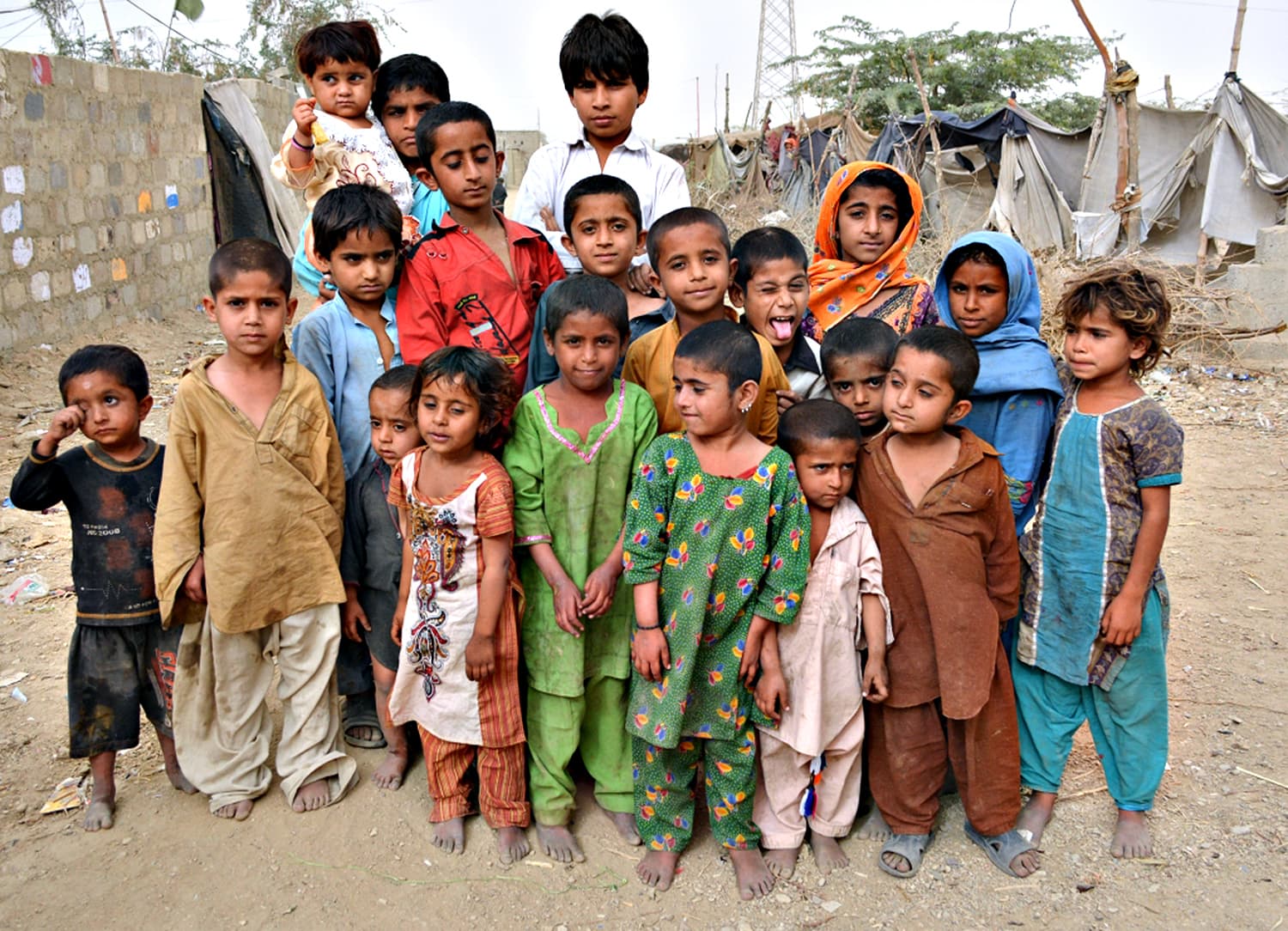 A group of children pose for the camera in Karachi’s Sindhabad slum.