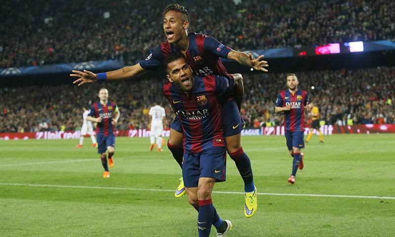 Neymar celebrates with Dani Alves after scoring the second goal for Barcelona.— Reuters