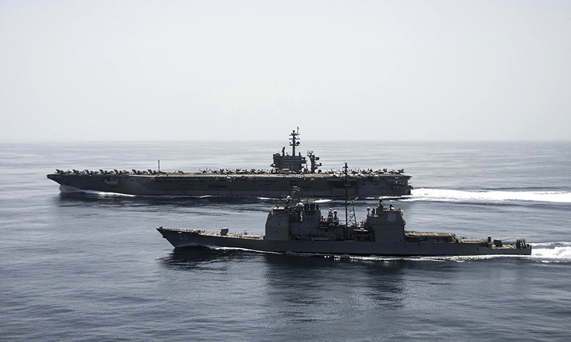 The aircraft carrier USS Theodore Roosevelt (CVN 71) and the guided-missile cruiser USS Normandy (CG 60) operate in the Arabian Sea conducting maritime security operations in this U.S. Navy photo taken April 21, 2015. — Reuters