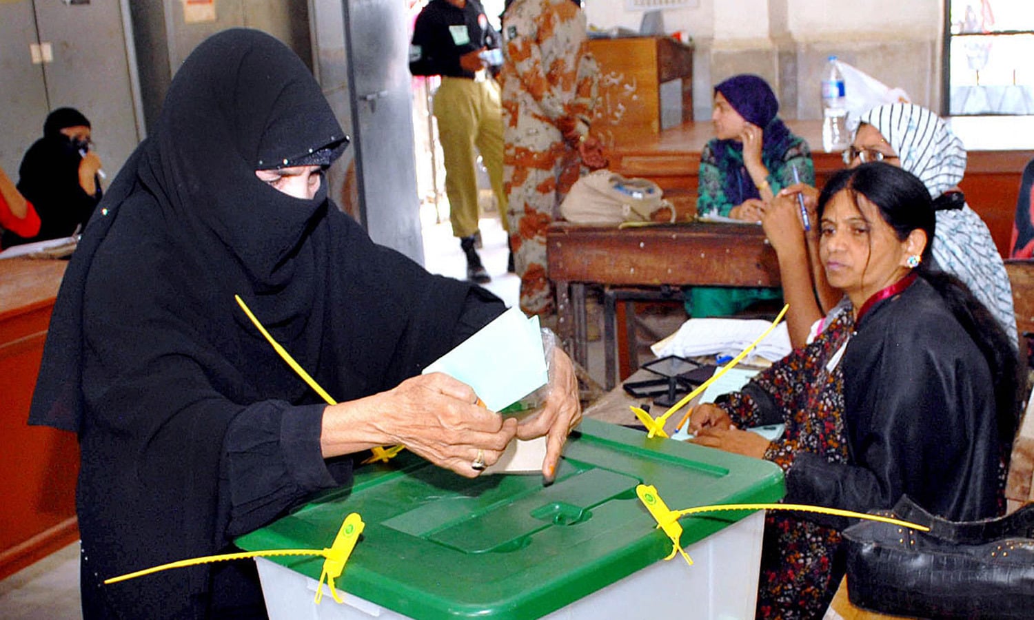 A lady casts her vote in a polling station during by-election in the constituency of NA-246. Photo by M. Toheed