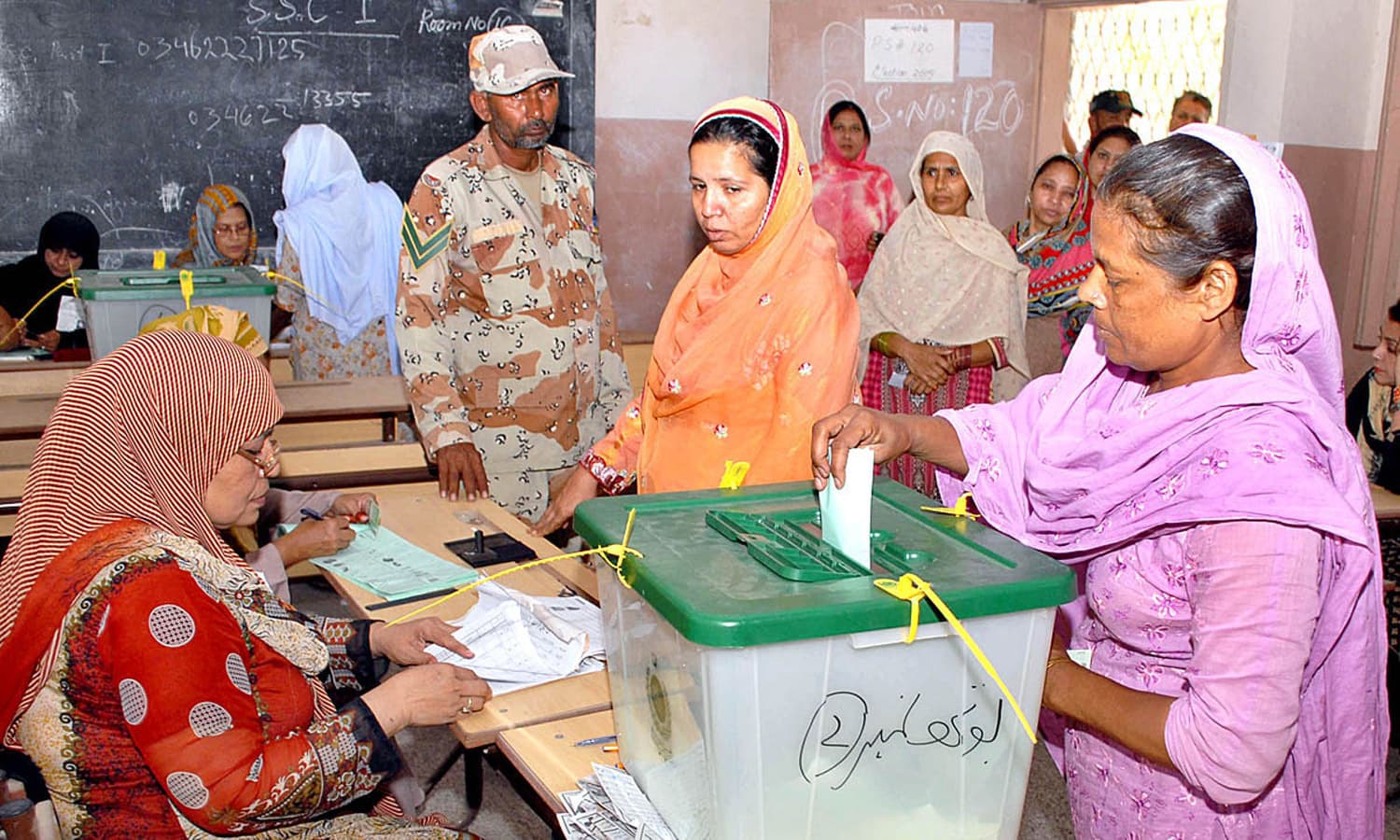 A lady casts her vote in a polling station during by-election in the constituency of NA-246. Photo by M. Toheed