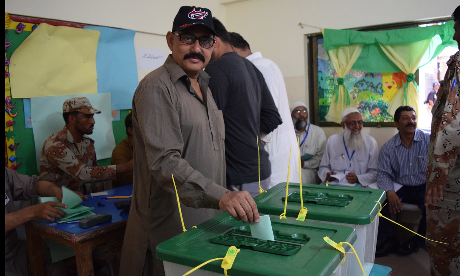 A man casts his vote at a polling station during the by-election. Photo by Zoya Anwer