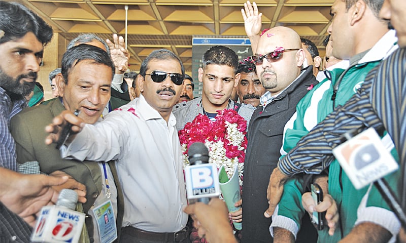 British boxer Aamir Khan on his arrival at the Karachi airport