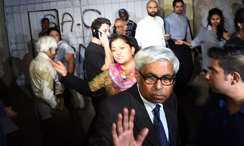 In this picture taken on April 24, 2015, Pakistani relatives and activists gather outside a hospital following the death of female rights activist Sabeen Mehmood in Karachi. —AFP