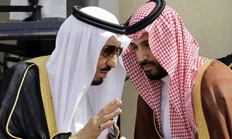 King Salman speaks with his son Prince Mohammed, who he appointed as the deputy crown prince on Wednesday. —AP/File