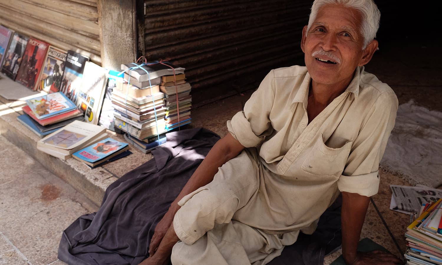 A bookseller at Regal chowk. — Photo by Farooq Soomro