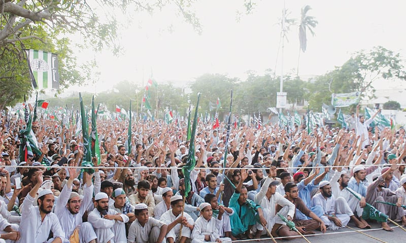 Participants in an Ahle Sunnat Wal Jamaat rally titled Tahaffuz-i-Harmain Sharifain Conference held near the Mazar-i-Quaid chant slogans on Friday.—PPI